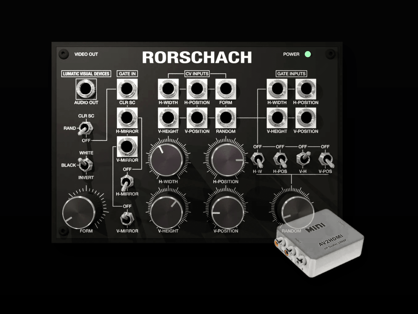 A Rorschach modular synthesizer control panel shown against a black background, with a small white HMI controller placed in front. The main product is the Rorschach panel, with visible controls, knobs, and labels including VIDEO OUT, POWER, and various audio/visual inputs.